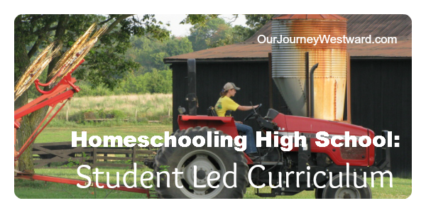 Girl in yellow shirt drives a red tractor. For a blog post about student led curriculum