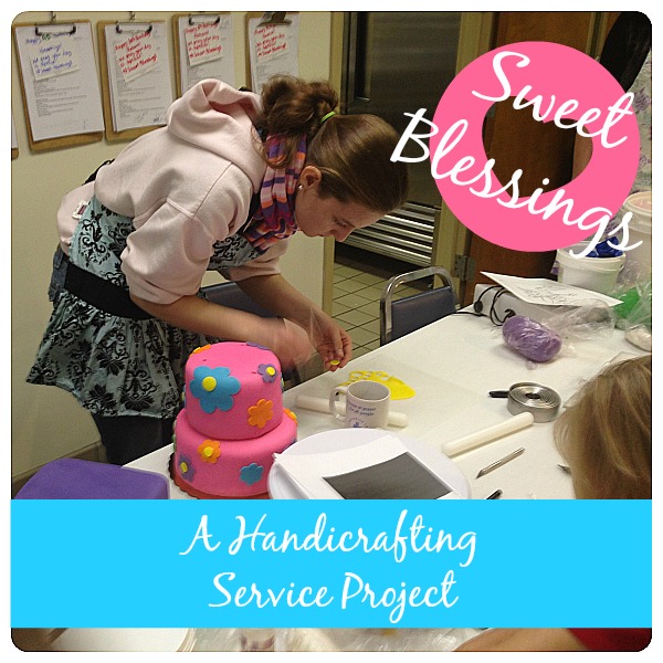 A girl decorates a pink cake with blue, orange, and purple flowers. For a blog post about a service project for sweet blessings.