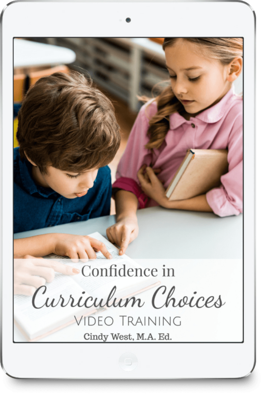 A boy and a girl studying a book. Advertising a masterclass about curriculum choices.