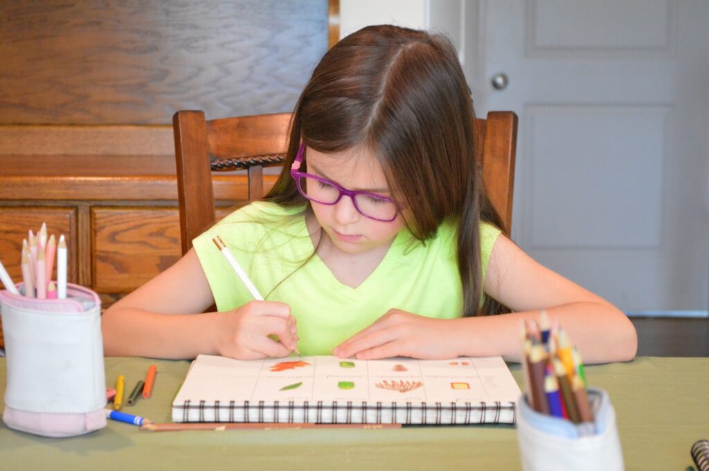 girl working in her nature journal