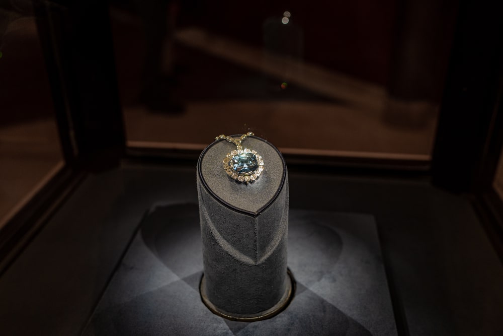 The blue Hope Diamond on a grey display